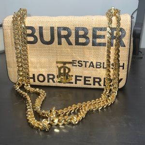 BURBERRY
SM LOLA PRINT COATED RAFFIA BAG